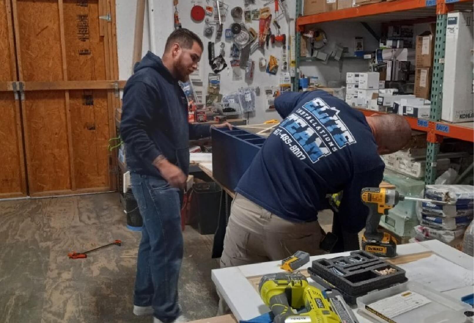 a couple of men working in a workshop
